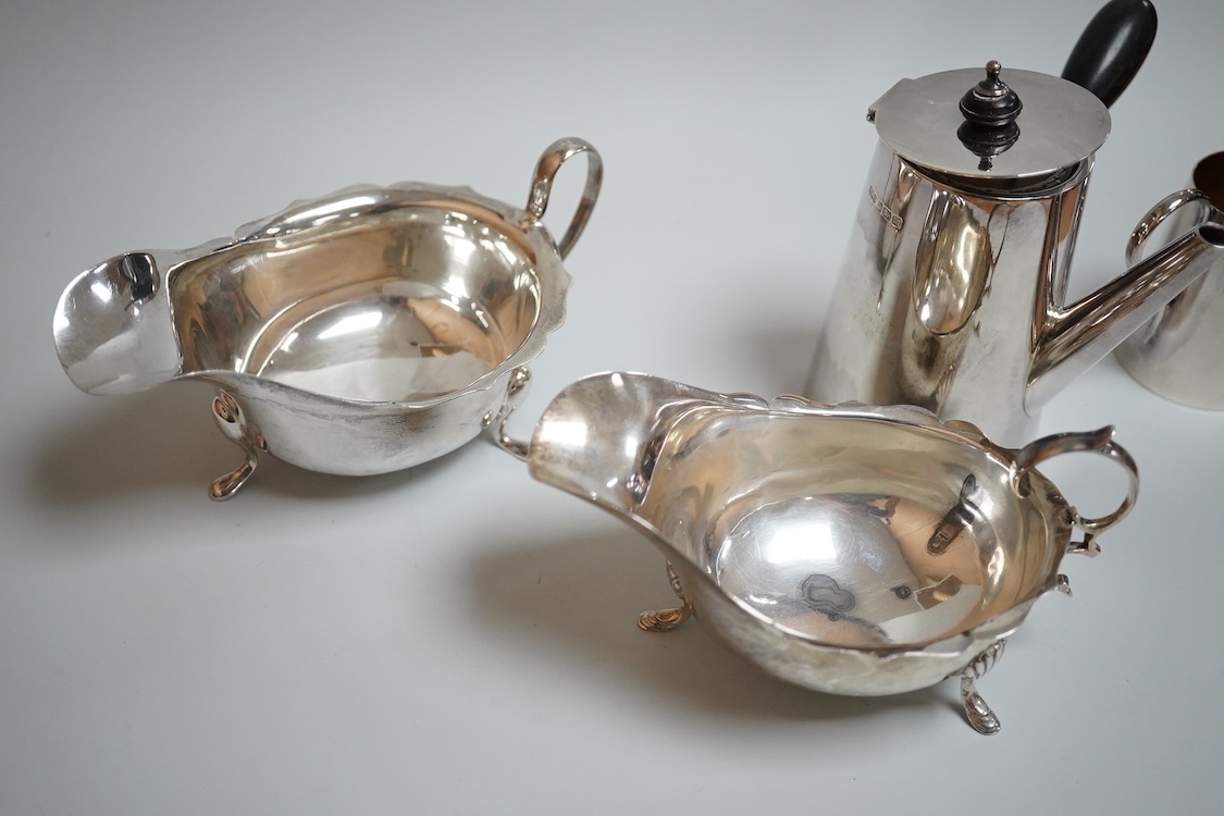 Sundry silver including two George V silver sauce boats, a silver café au lait pot, a small silver cream jug, three small silver dishes, a silver mounted glass sugar sifter and a silver mounted glass ashtray.